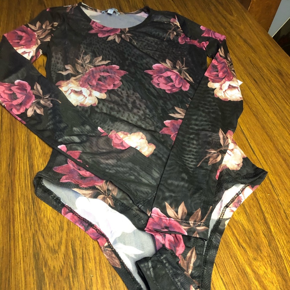 Charlotte Russe top floral body suit. Nwt never worn